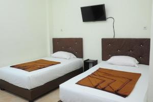 Una cama o camas en una habitación de Dena Hotel 34 fotos más