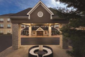 a rendering of a building with a house at Country Inn & Suites by Radisson, Nashville Airport East, TN in Nashville