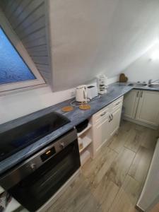 A kitchen or kitchenette at Sándor Apartman