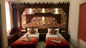 Hotel Pearl Palace Jaipur房間的床