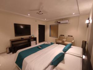 Postel nebo postele na pokoji v ubytování Jazzy Beach Guest Rooms