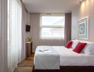 Postel nebo postele na pokoji v ubytování Posta Design Hotel