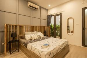 Postel nebo postele na pokoji v ubytování Homestay CHẤT-Self check,Kitchen,Free Laundry