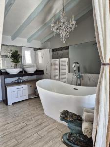 a bathroom with a large white tub and two sinks at Casa Roberto Altea in Altea +75 photos