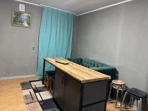 a living room with a green couch and a table at DelLuna in Almaty