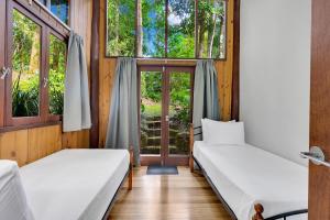 Postel nebo postele na pokoji v ubytování Pole home in paradise at Kuranda