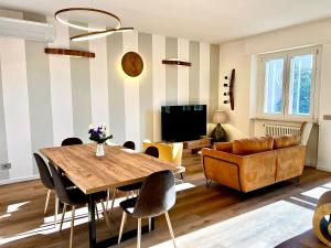 a living room with a table and a couch at Chianti 67 Home Holiday in Castelnuovo Berardenga