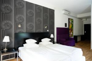 Hotel Villa Ruimzicht tesisinde bir odada yatak veya yataklar