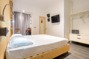 TV a/nebo společenská místnost v ubytování Hotel Perla - The storyhoteller