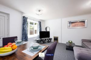 a living room with a table with fruit on it at Centrally Located 3 Bedroom House By Trinity Stays Short Lets & Serviced Accommodation Cambridge in Cambridge