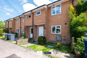 a brick house with a white door at Centrally Located 3 Bedroom House By Trinity Stays Short Lets & Serviced Accommodation Cambridge in Cambridge