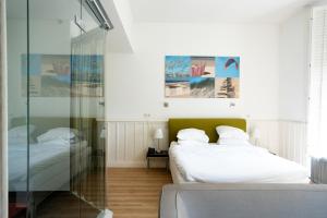 Hotel Villa Ruimzicht tesisinde bir odada yatak veya yataklar