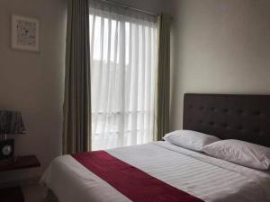 Postel nebo postele na pokoji v ubytování Resort88 Villa