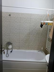 a bathroom with a bath tub and a sink at casa lidia in Brăila