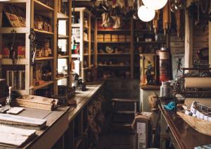 a room filled with lots of shelves and a long counter at Svinøya Rorbuer in Svolvær