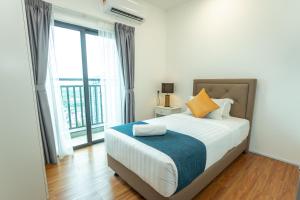 a bedroom with a bed and a large window at UCSI Residence 2 By UCSI Hotels in Kuala Lumpur +52 photos