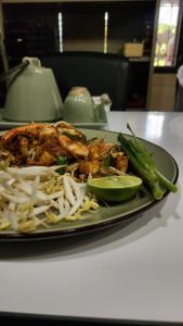 a plate of food on a table with food on it at Yenta4fafad in Ban Na Ta Luang (1)