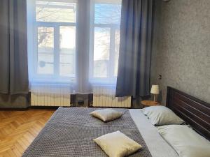 Postel nebo postele na pokoji v ubytování O.O.APART.2