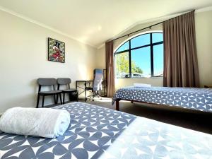 Ένα ή περισσότερα κρεβάτια σε δωμάτιο στο Spacious Comfty 4 BDMs House in Rototuna
