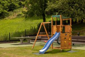 a playground with a slide and a slideintend at Villa Alea in Vinogradi Ludbreški