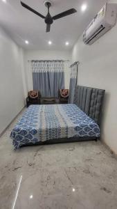Postel nebo postele na pokoji v ubytování Jairam Homestay