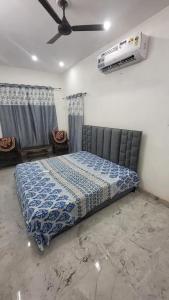 Postel nebo postele na pokoji v ubytování Jairam Homestay