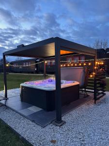 a canopy bed with lights on top of it at Stacja Galicja - nocleg w pociągu blisko Energylandia in Zator