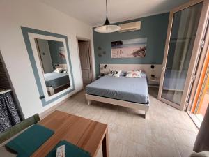 Ένα ή περισσότερα κρεβάτια σε δωμάτιο στο monolocale a pochi minuti da BARATTI