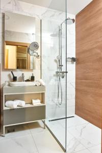 a bathroom with a shower and a sink at ZLATIBORSKO JEZERO 2 Lux&Spa in Zlatibor