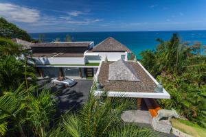 an aerial view of a house with the ocean in the background at Bluesiam Villas - SHA Certified in Surin Beach