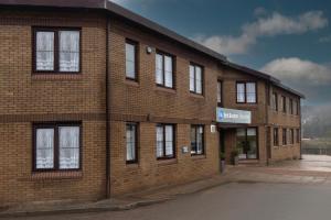 a brick building with windows on the side of it at Best Western Ebbw Vale in Ebbw Vale