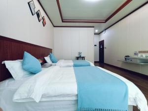Letto o letti in una camera di Meizhou Cloudy B&B