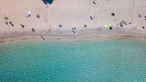 an overhead view of a beach with a group of people at Domìa Boutique Hotel e Cucina in Mondello