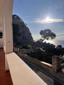 a view of the ocean from the balcony of a building at Apartment in Villa Argentina in Capri