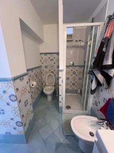 a bathroom with a toilet and a sink at Apartment in Villa Argentina in Capri +6 photos