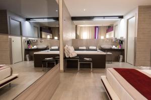 A bed or beds in a room at AS Hotel Limbiate Fiera
