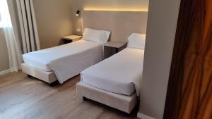 Katil atau katil-katil dalam bilik di Hotel Pomara