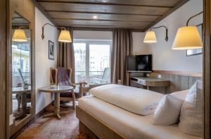 TV a/nebo společenská místnost v ubytování Hotel Promenade