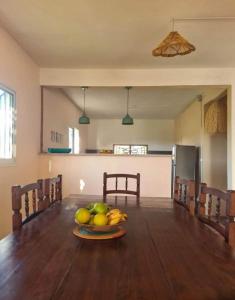 a bowl of fruit on a table in a kitchen at Ikigaï Lodge in Madirokely
