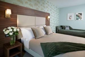Posteľ alebo postele v izbe v ubytovaní Hotel Spigamonti