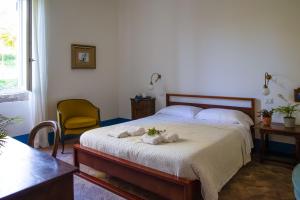 a bedroom with a bed with towels on it at Agriturismo Morani in Santa Severa