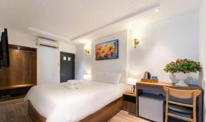 Postel nebo postele na pokoji v ubytování Thuan Phat Hostel