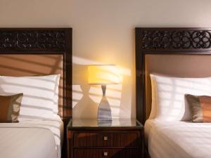 Postel nebo postele na pokoji v ubytování Fairmont Makati