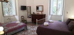 Postel nebo postele na pokoji v ubytování B&B Domus Aurea