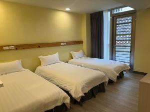 Postel nebo postele na pokoji v ubytování 慢且洄瀾文旅 Bantshiann Hualie Hotel