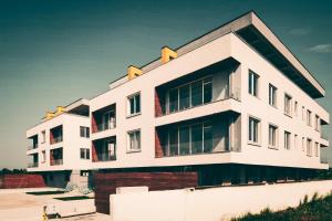 a large white building with a lot of windows at Apartament cu terasă in Bucharest
