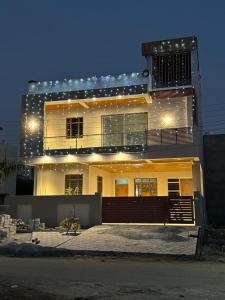 a large house with lights on top of it at Praleen Villa in Udaipur