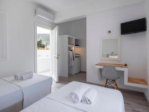 Postel nebo postele na pokoji v ubytování Grozos Rooms