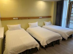 Postel nebo postele na pokoji v ubytování 慢且洄瀾文旅 Bantshiann Hualie Hotel