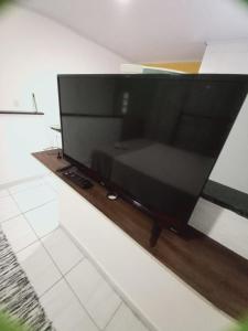 a large flat screen tv sitting on a table at Hospedagem da Lu in Paraty
